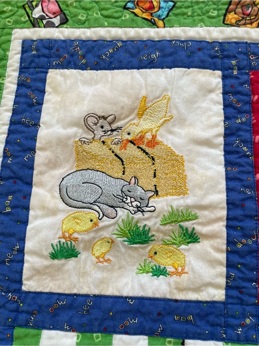 Quack, Moo, Oink quilt with farm animals and 'Quack, Moo, Oink'